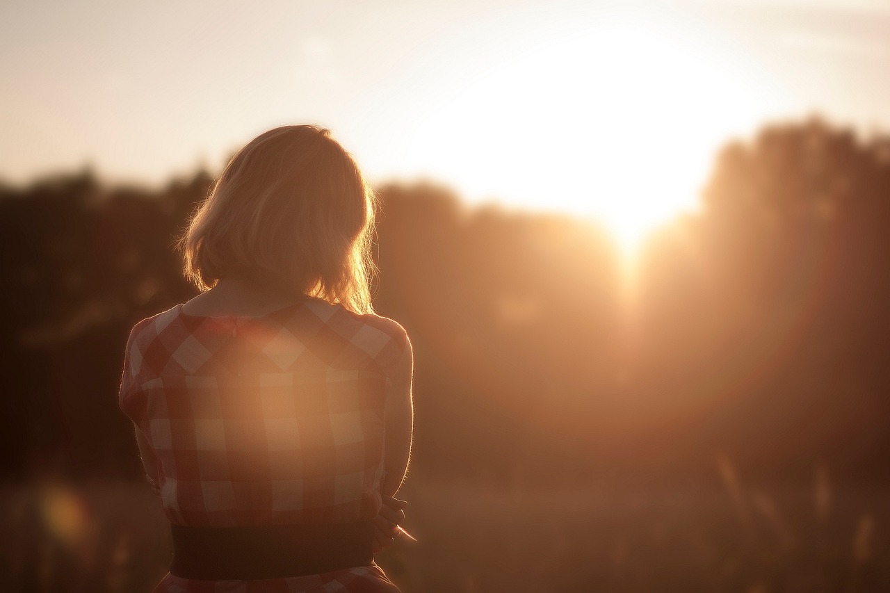 Woman walking at sunset